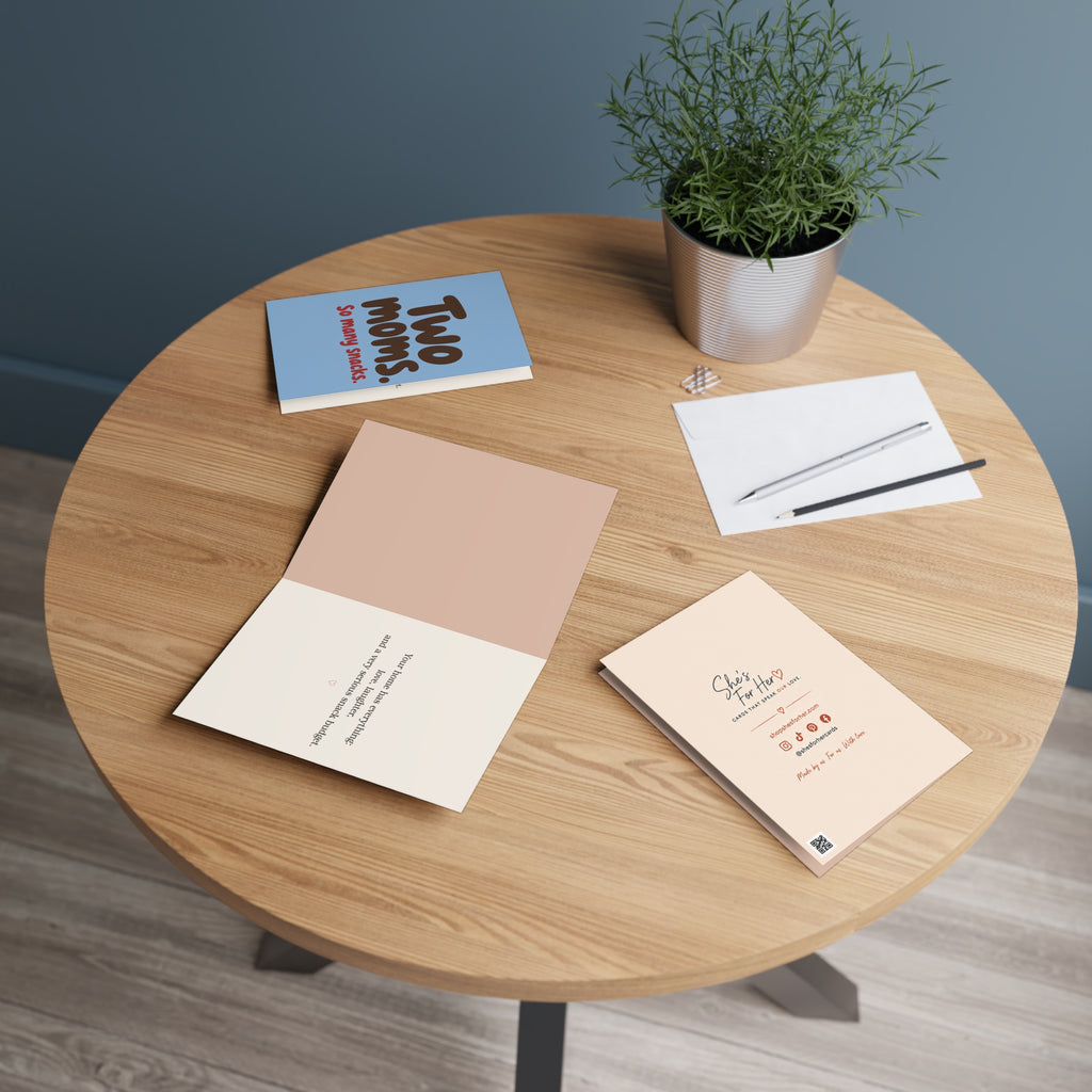 Greeting card in a setting: "Two Moms. So many snacks." Greeting Card for Moms